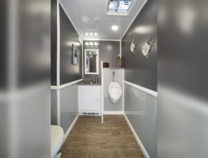 interior of a restroom trailer with urinal